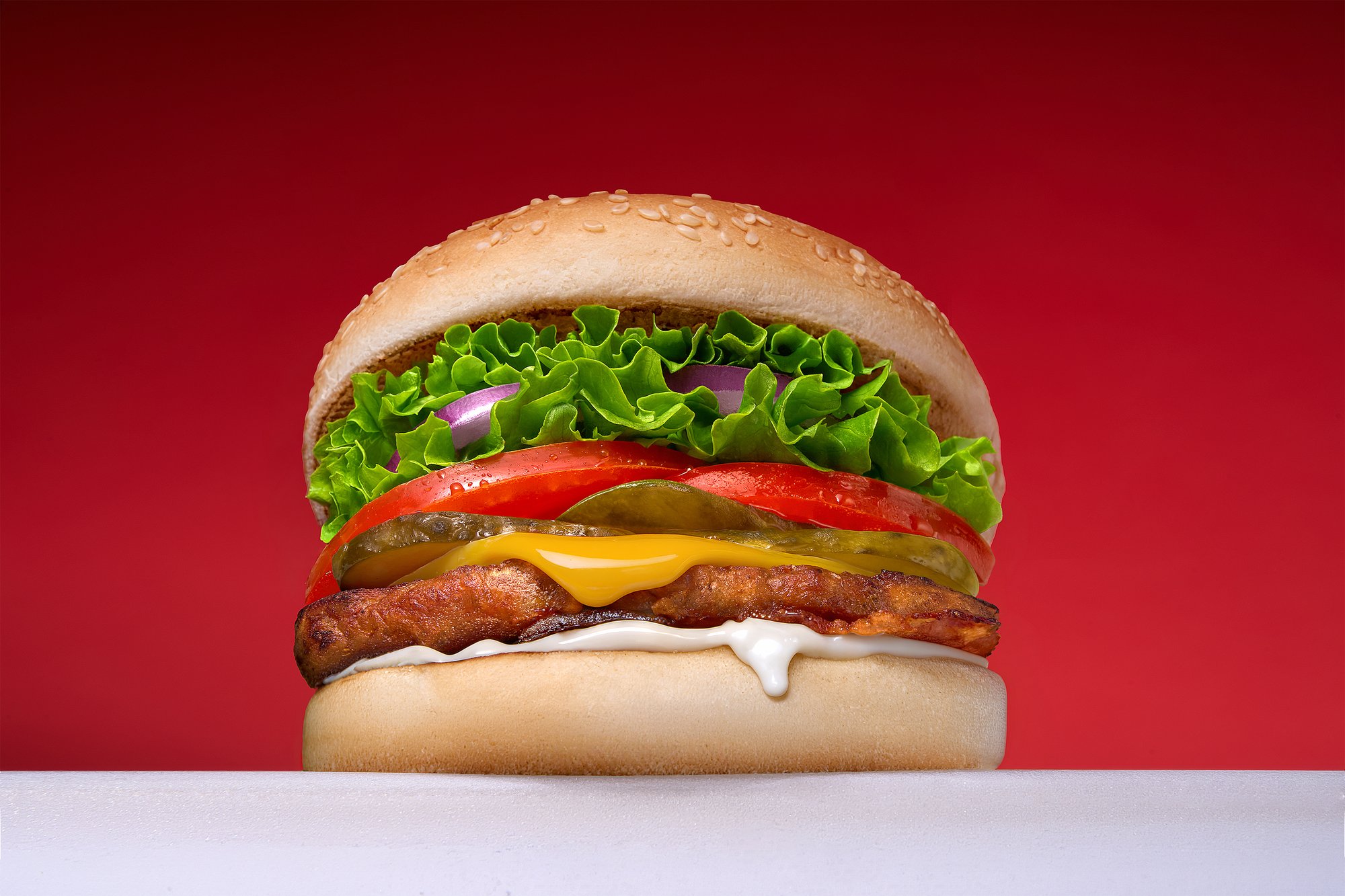 Hamburger on red background