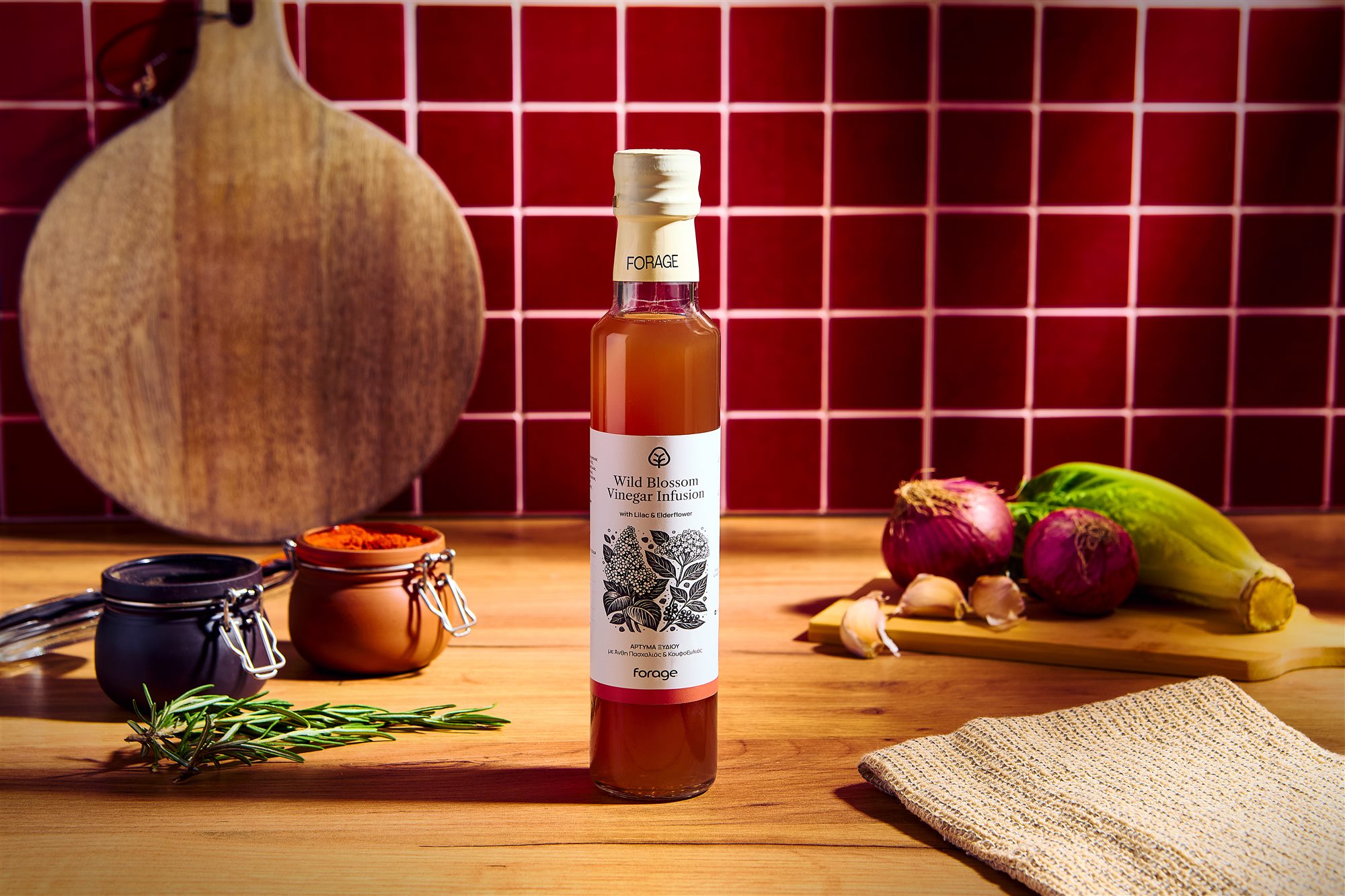 Forage wild blossom vinegar infusion bottle on red tile kitchen set