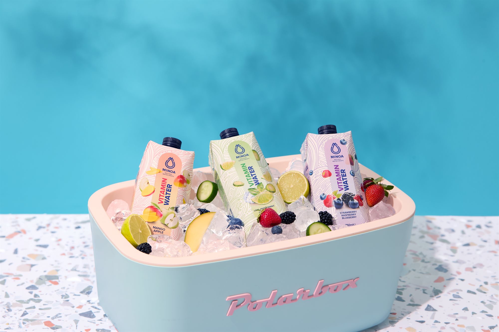 Minoa Water full product range in a cooler box wide composition