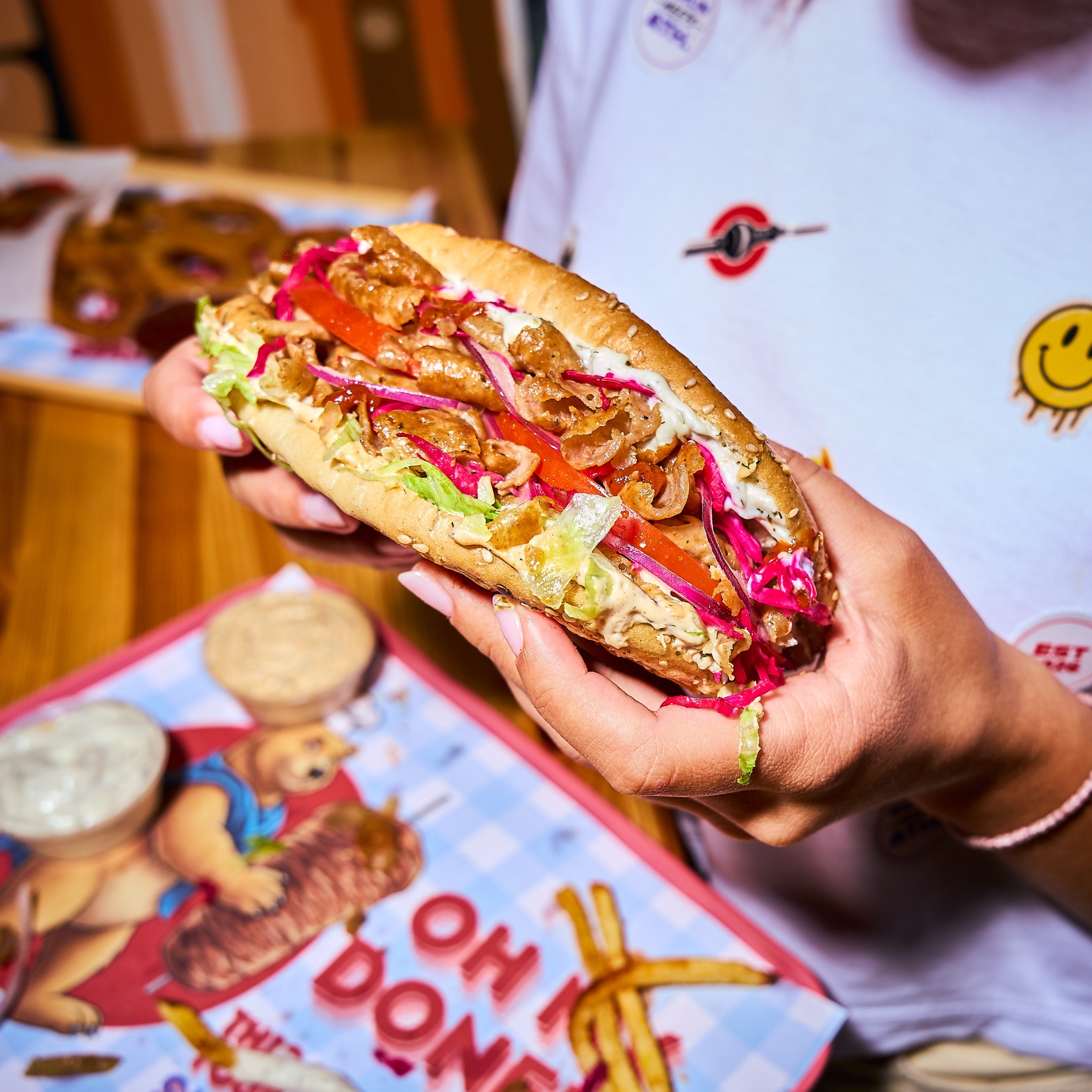 Super Berlin Doner loaded sandwich hand-held detail