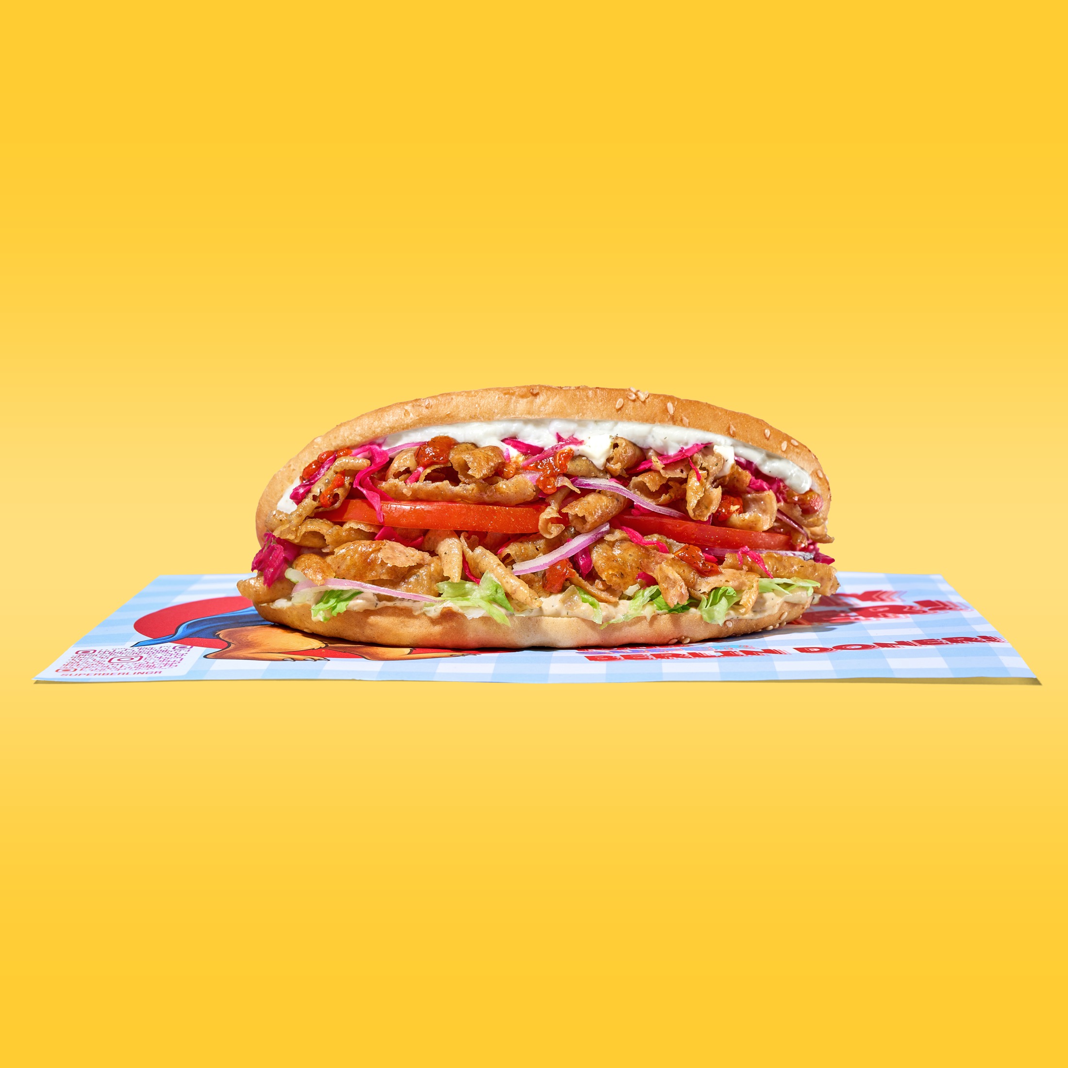 Super Berlin Doner studio sandwich product on yellow background